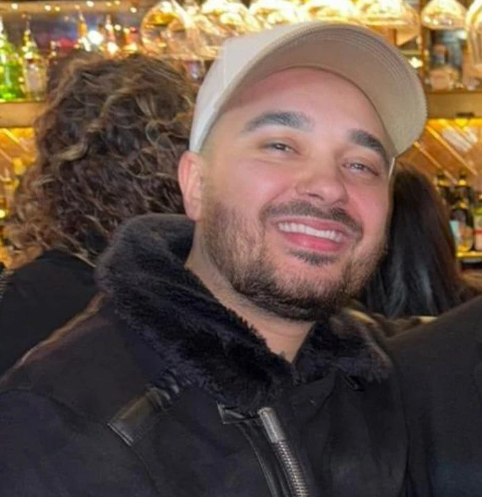 Wolfe smiling during an evening out